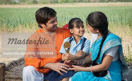 Rural couple enjoying the achievement of their daughter, Sohna, Haryana, India