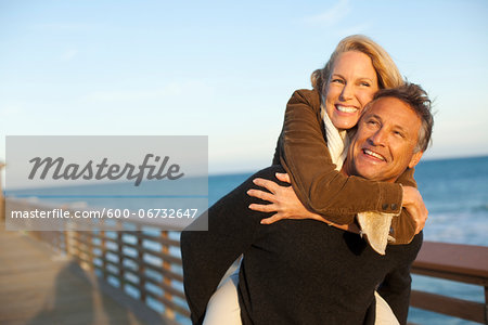 Mature Couple having Fun Walking along Pier, Jupiter, Palm Beach County, Florida, USA