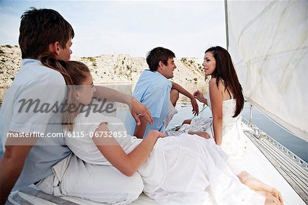 Croatia, Young couples on sailboat relaxing