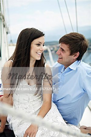 Croatia, Young couple relaxing on sailboat