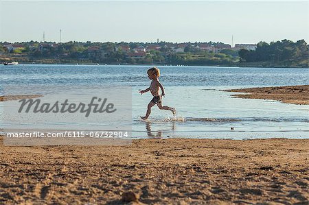 Croatia, Dalmatia, Little Boy Playing On Beach