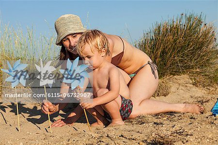 Croatia, Dalmatia, Mother And Son Playing On Beach