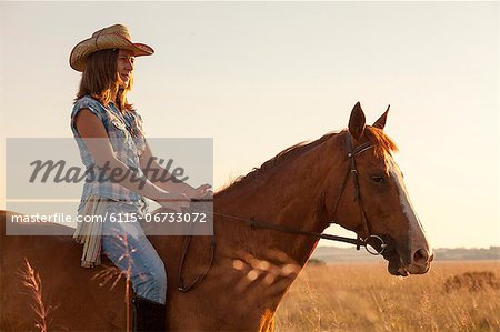 Croatia, Dalmatia, Young woman horseback riding