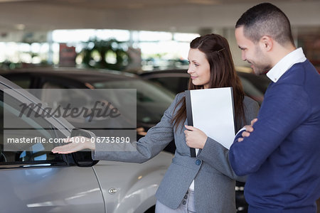 Man looking at a car in a dealership