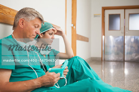 Serious surgeons waiting in the corridor in hospital