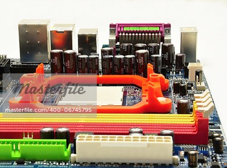 Small electronic components on the motherboard computer on white background