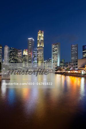 Singapore Central Business District (CBD) City Skyline by Boat Quay Along Singapore River at Blue Hour Vertical