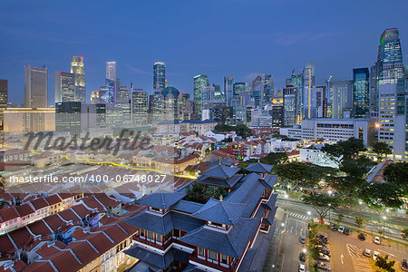 Singapore City Central Business District (CBD) Over Chinatown Area with Old Houses and Chinese Temple at Blue Hour