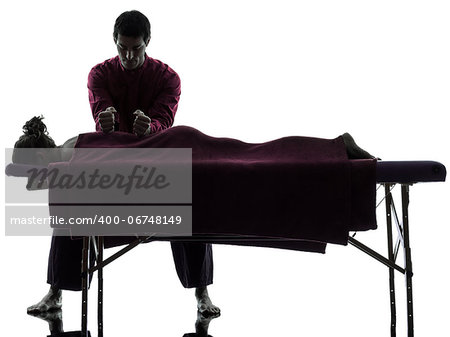 man woman back massage in silhouette studio on white background