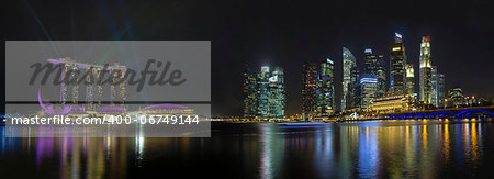 Singapore City Skyline with Laser Light Show Along Singapore River at Night Panorama