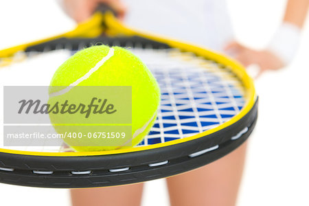 Closeup on female tennis player holding racket with ball