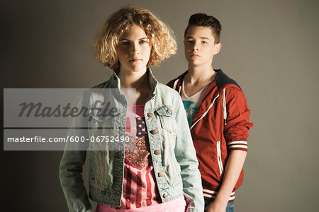 Portrait of Teenage Girl and Boy, Studio Shot