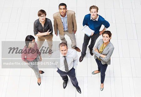 Business people smiling in hallway