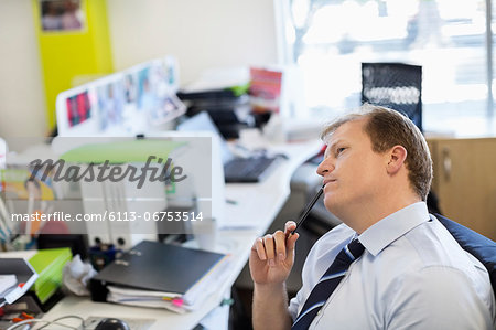 Businessman thinking at desk