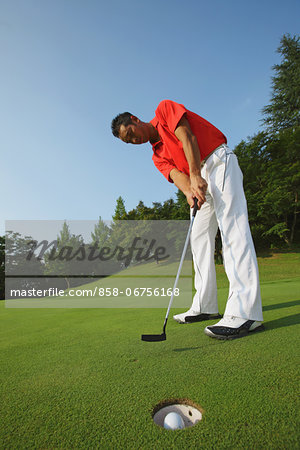 Golfer Putt Successfully Into Hole