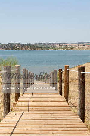 Wooden walkway serving Amieira pier on the banks of the reservoir of Alqueva, Alentejo, Portugal