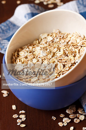 Oat flakes in a bowl close up.