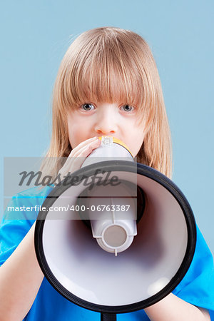 boy with long blond hair playing with megaphone - isolated on blue