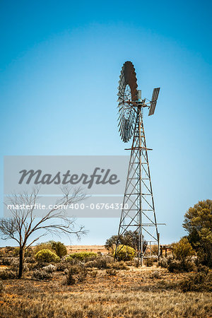 An image of a farming windmill in the australian outback