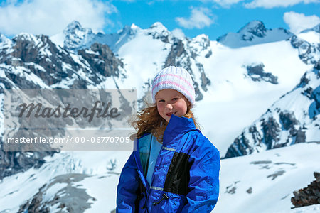 Summer mountain view from Stelvio pass with snow on slope (Italy) and girl portrait.