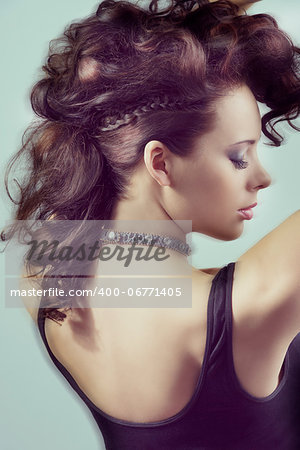 close-up portrait of fashion brunette lady with creative curly hair-style and black bra with moving blur effect