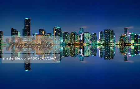 The Miami skyline at night with almost no clouds and nearly perfect reflections