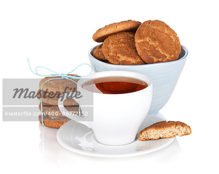 Tea cup with homemade cookies. Isolated on white background
