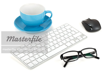 Coffee cup, keyboard, mouse and glasses. Isolated on white background