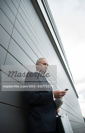 Businessman using Cell Phone Outdoors, Mannheim, Baden-Wurttemberg, Germany