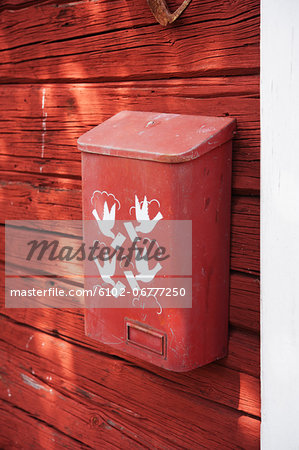 Close-up of letter box on wooden wall