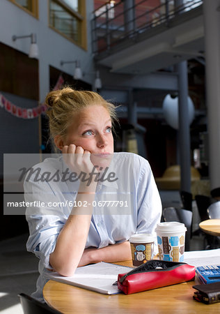 University student studying in cafe