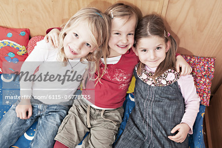 Three Girls On Sofa, Kottgeisering, Bavaria, Germany, Europe