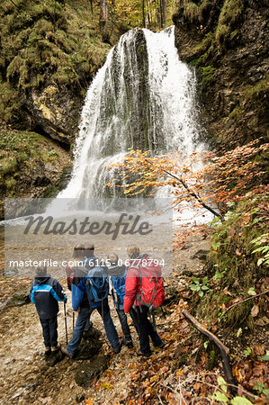 Family In Front Of A Waterfall, Bavaria, Germany, Europe