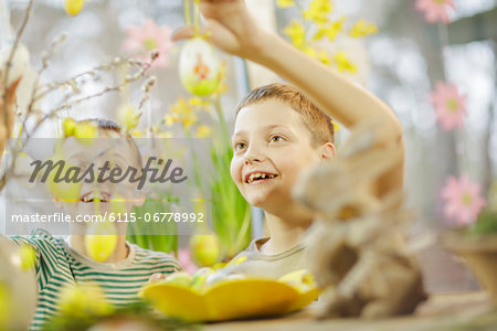 Boys Hanging Easter Decoration, Osijek, Croatia, Europe