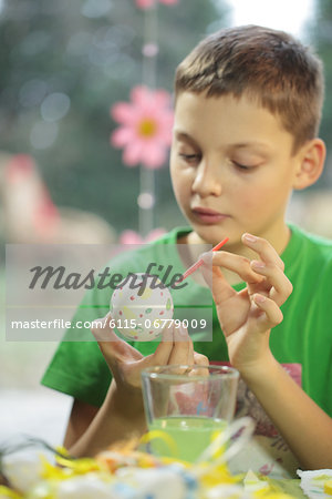 Boy Painting Easter Eggs, Osijek, Croatia, Europe