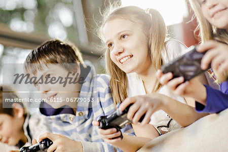 Children playing video game, Osijek, Croatia, Europe