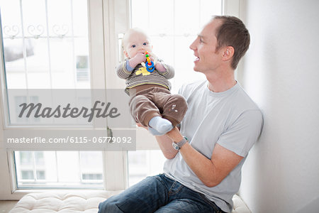 Father with baby in his arms, Munich, Bavaria, Germany