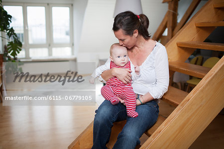 Young mother with baby girl at home, Munich, Bavaria, Germany