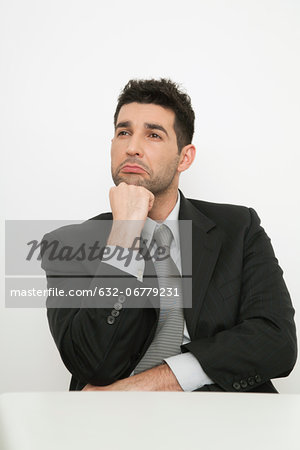 Mid-adult businessman with sad face