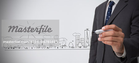 Businessman drawing out a town plan doodle Businessman drawing out a town plan doodle