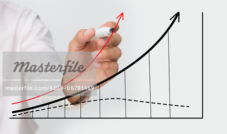 Businessman drawing graph