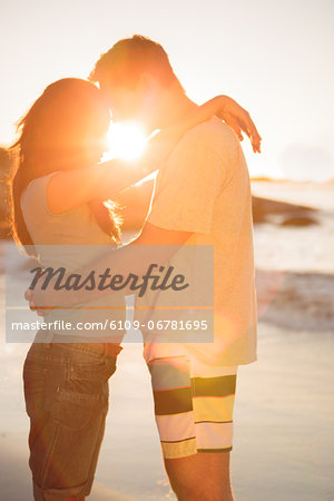 Lovers embracing each other on the beach