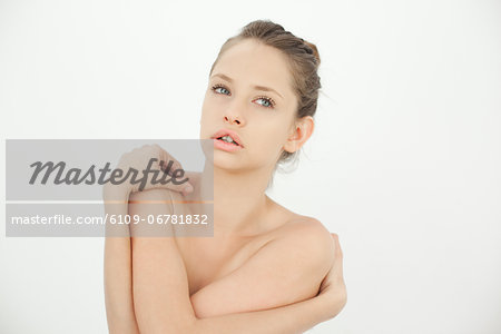 Beautiful topless woman looking away