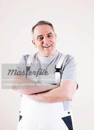 Portrait of Man wearing Overalls, Studio Shot