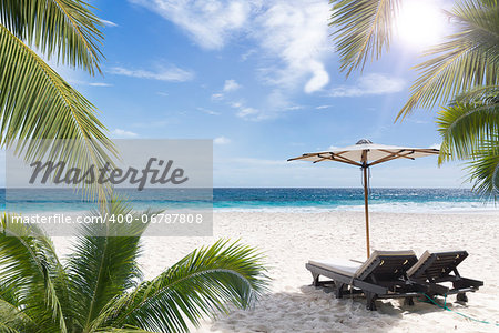 Beach chair at sunny coast. Seychelles. Mahe island.