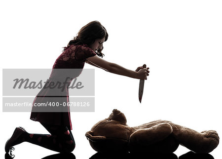 one caucasian strange young woman killing her teddy bear  in silhouette white background