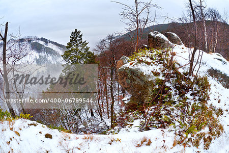 view on winter Harz mountains from Ilsestein cliff, fisheye view