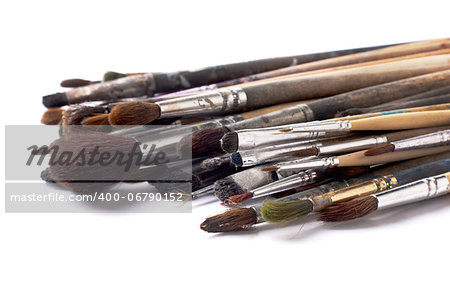 old paint brushes on a white background