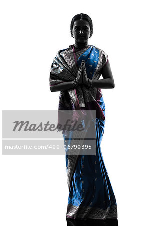 one indian woman saluting praying in silhouette studio isolated on white background