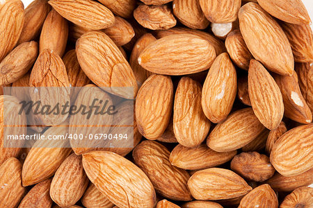 background of fresh dry fresh brown almonds